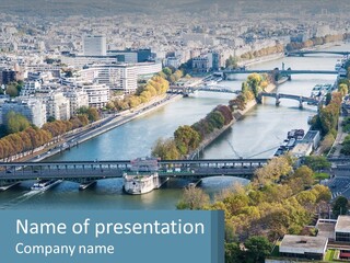 A Bridge Over A River With A City In The Background PowerPoint Template