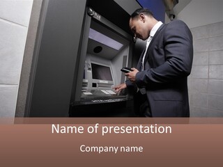 A Man In A Suit Is Using An Atm Machine PowerPoint Template