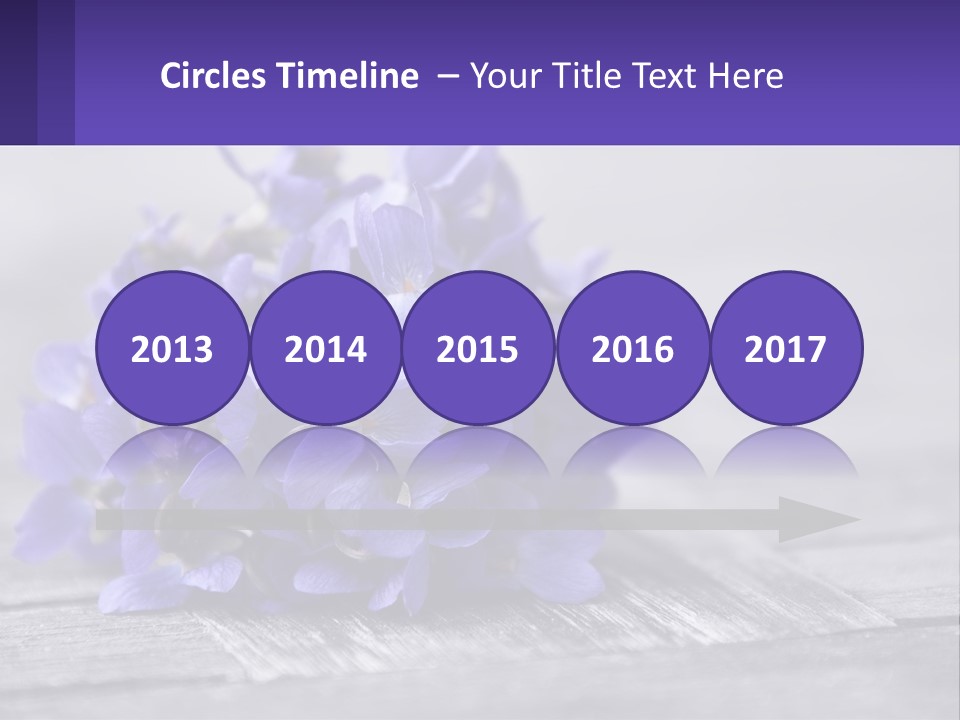 A Bunch Of Purple Flowers Sitting On Top Of A Wooden Table PowerPoint Template