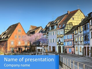 A Row Of Old Buildings With A Blue Sky In The Background PowerPoint Template