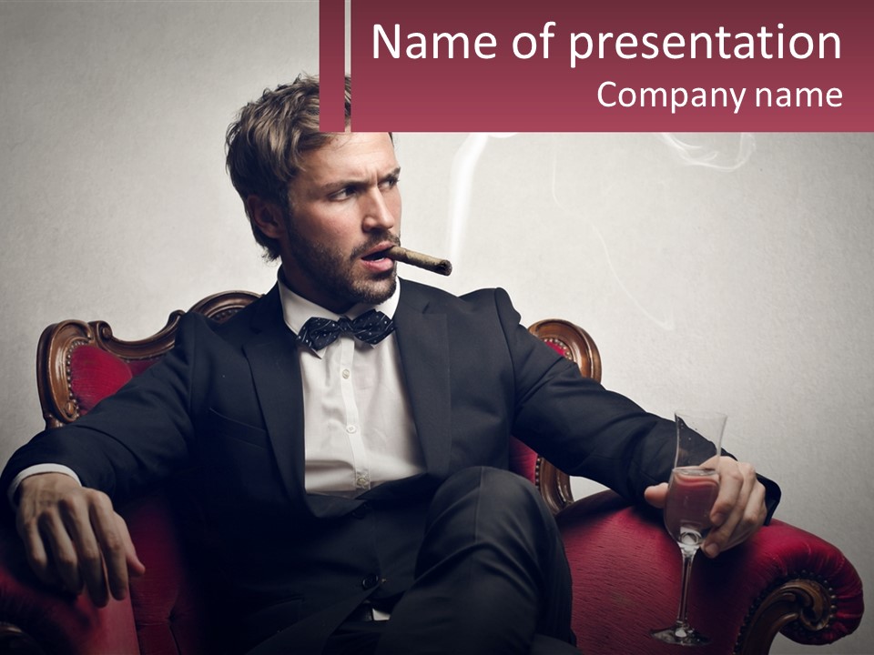A Man Sitting In A Chair With A Cigarette In His Mouth PowerPoint Template