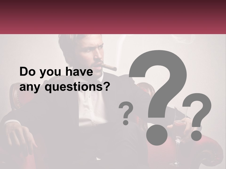 A Man Sitting In A Chair With A Cigarette In His Mouth PowerPoint Template