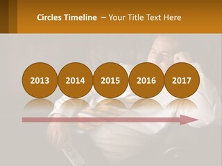 A Man Sitting On A Couch With A Tie On PowerPoint Template