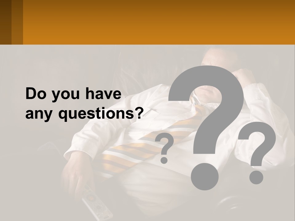 A Man Sitting On A Couch With A Tie On PowerPoint Template