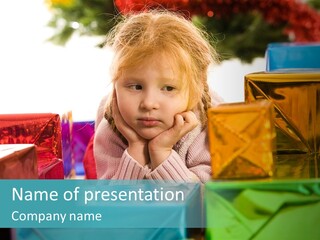 A Little Girl Sitting In Front Of A Pile Of Presents PowerPoint Template