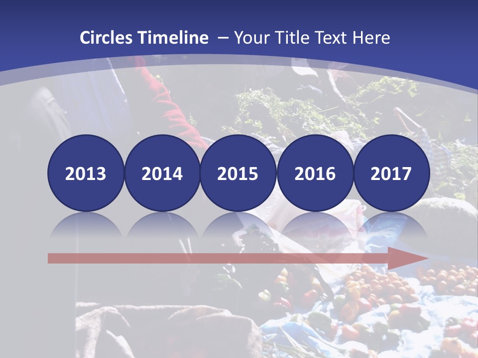 A Group Of People Sitting Around A Table Full Of Vegetables PowerPoint Template