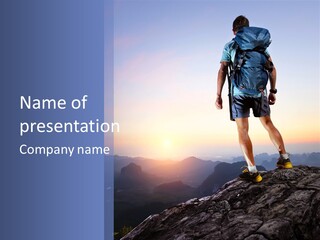 A Man Standing On Top Of A Mountain With A Backpack PowerPoint Template