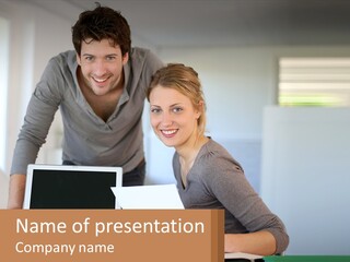 A Man And A Woman Looking At A Laptop Screen PowerPoint Template