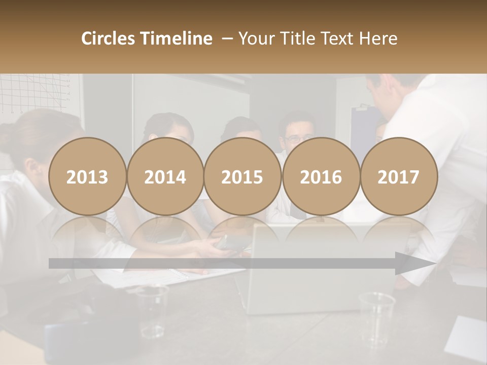 A Group Of People Sitting Around A Laptop Computer PowerPoint Template