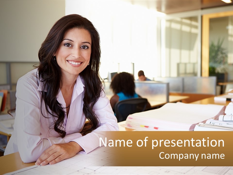 A Woman Sitting At A Desk In An Office PowerPoint Template