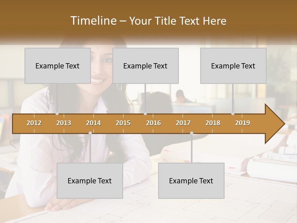 A Woman Sitting At A Desk In An Office PowerPoint Template