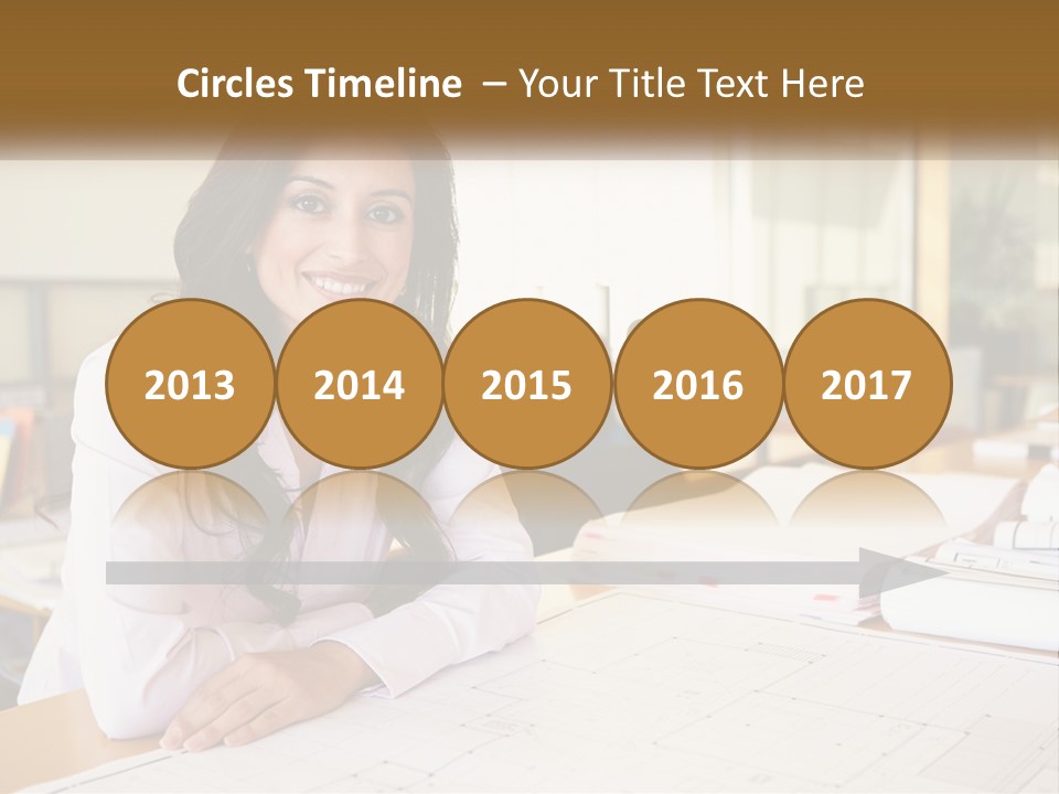 A Woman Sitting At A Desk In An Office PowerPoint Template