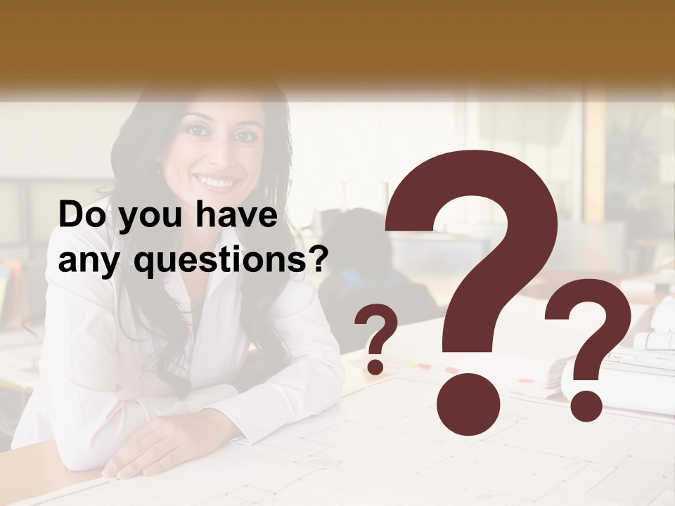 A Woman Sitting At A Desk In An Office PowerPoint Template