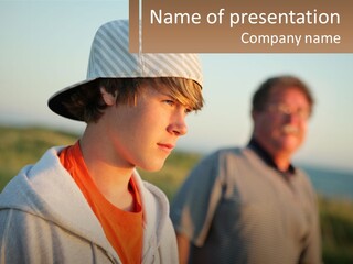 A Man And A Boy Standing Next To Each Other PowerPoint Template