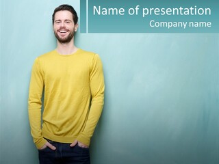 A Man Standing In Front Of A Blue Wall With His Hands In His Pockets PowerPoint Template