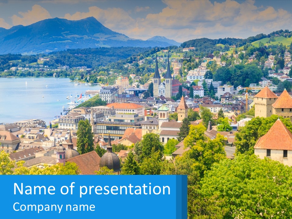A Scenic View Of A City With Mountains In The Background PowerPoint Template