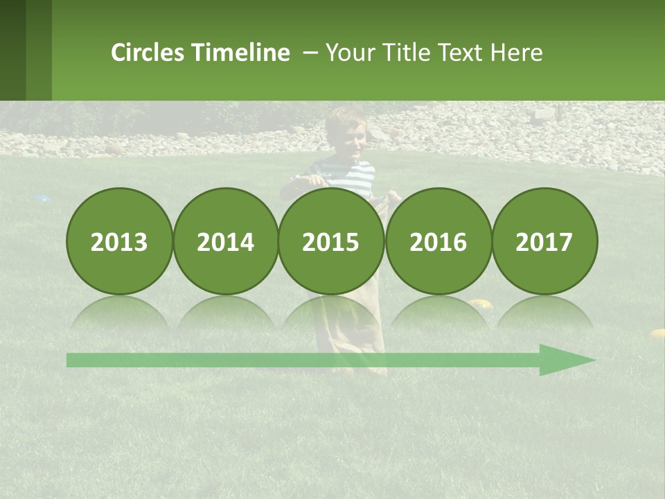 A Young Boy Standing On Top Of A Lush Green Field PowerPoint Template