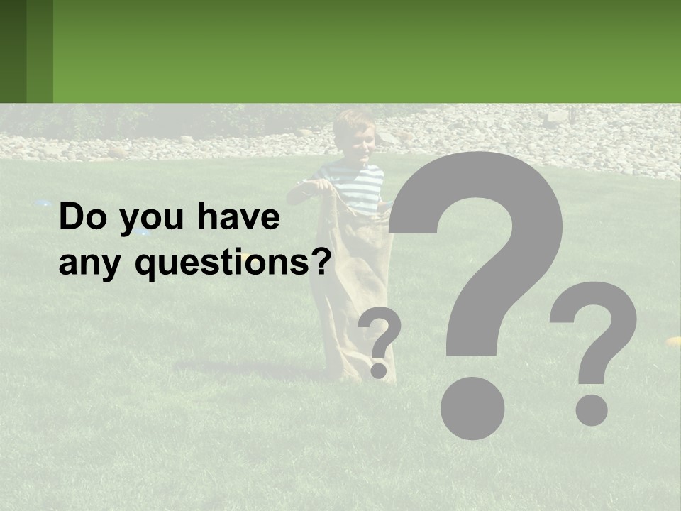 A Young Boy Standing On Top Of A Lush Green Field PowerPoint Template