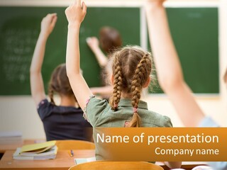 A Group Of Children Raising Their Hands In A Classroom PowerPoint Template