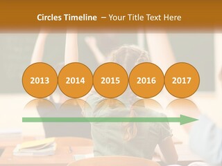 A Group Of Children Raising Their Hands In A Classroom PowerPoint Template