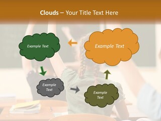 A Group Of Children Raising Their Hands In A Classroom PowerPoint Template