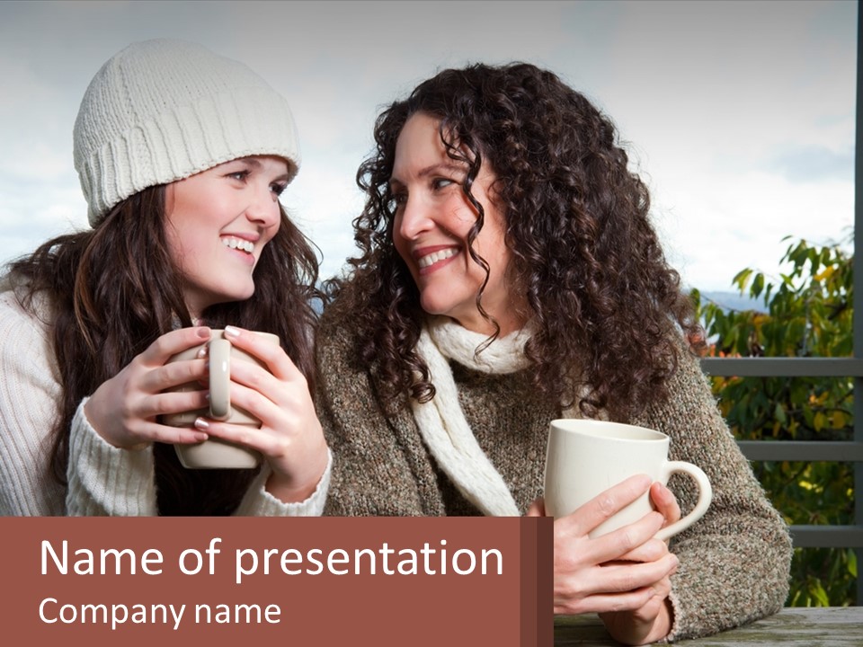 A Couple Of Women Sitting Next To Each Other Holding Coffee Mugs PowerPoint Template