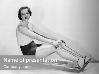A Woman Sitting On A Stationary Rowing Machine PowerPoint Template