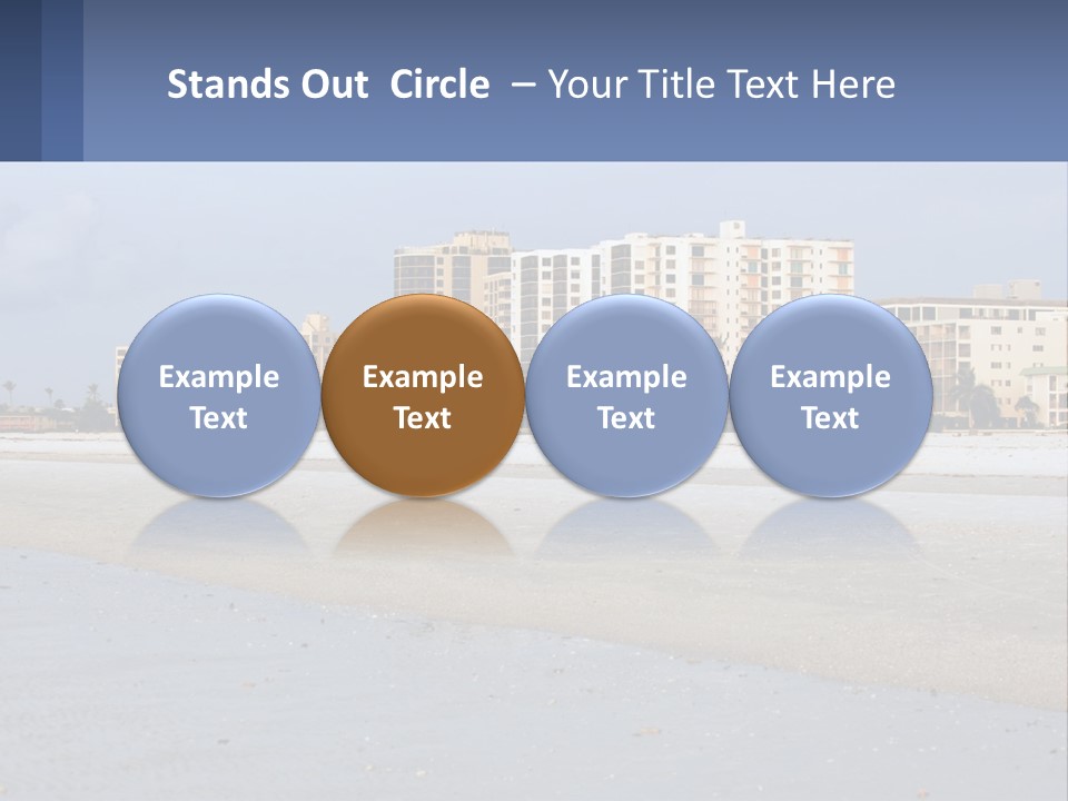 A Sandy Beach With Buildings In The Background PowerPoint Template