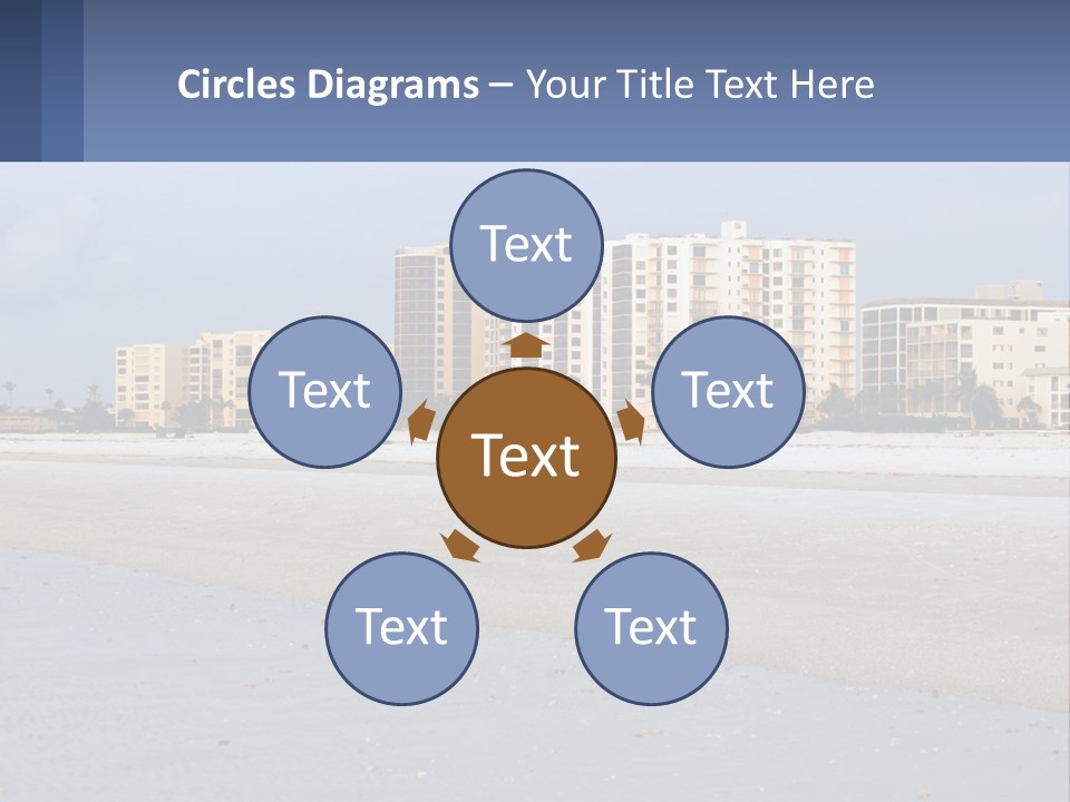 A Sandy Beach With Buildings In The Background PowerPoint Template