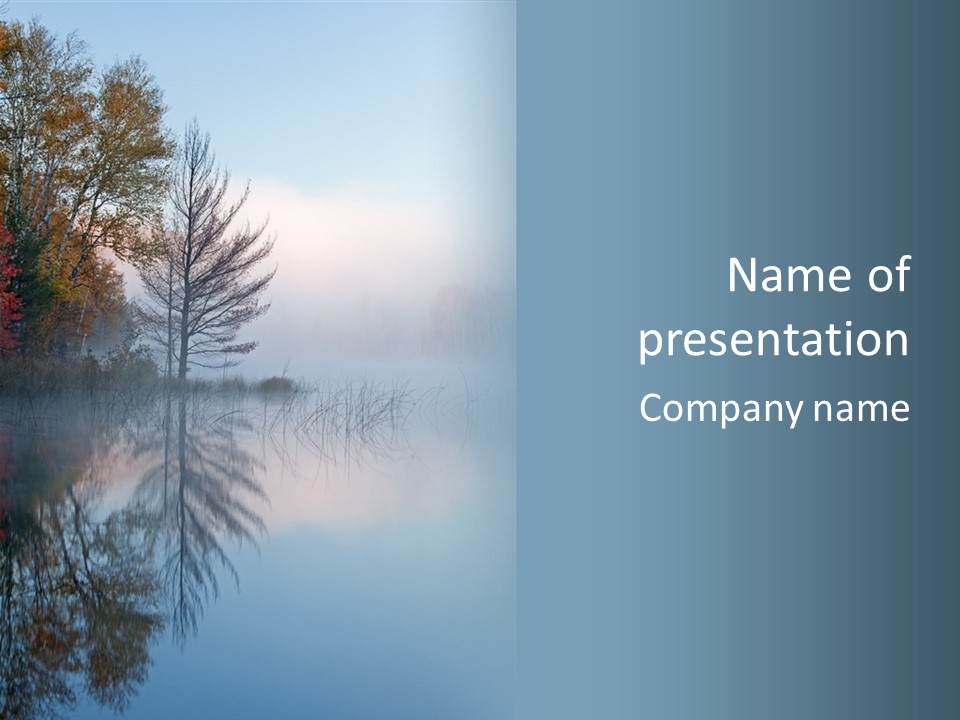 A Lake Surrounded By Trees With Fog In The Air PowerPoint Template