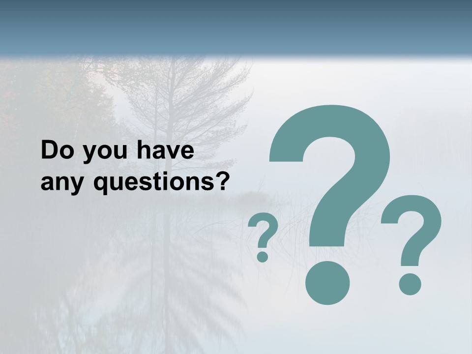 A Lake Surrounded By Trees With Fog In The Air PowerPoint Template