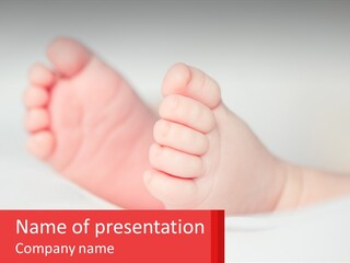 A Baby's Foot Is Shown With The Name Of The Baby PowerPoint Template