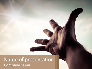 A Person Holding Their Hand Up To The Sky PowerPoint Template