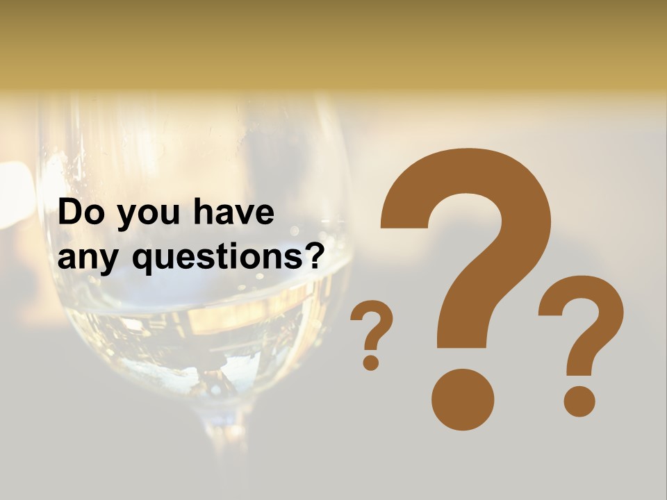 A Glass Of White Wine On A Table PowerPoint Template