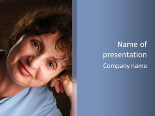 A Woman Is Smiling While Leaning Against A Wall PowerPoint Template