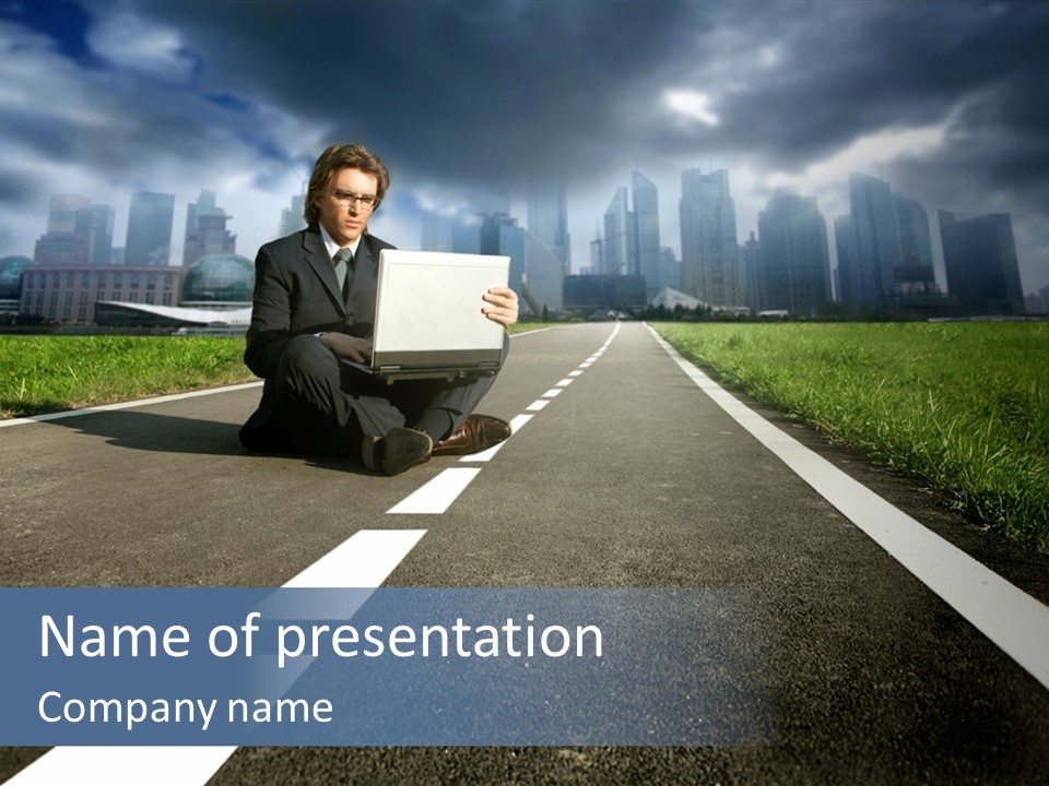 A Man Sitting On The Side Of A Road Holding A Laptop PowerPoint Template