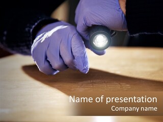 A Person Holding A Flashlight On Top Of A Wooden Table PowerPoint Template