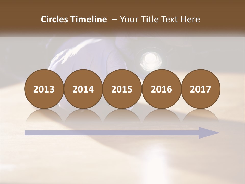 A Person Holding A Flashlight On Top Of A Wooden Table PowerPoint Template