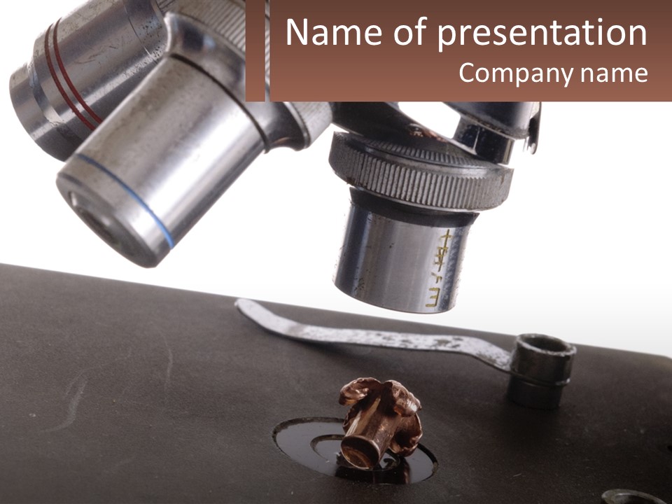 A Microscope And A Piece Of Chocolate On A Table PowerPoint Template