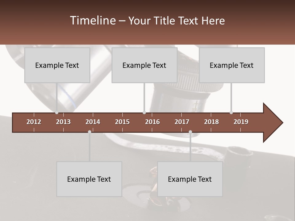 A Microscope And A Piece Of Chocolate On A Table PowerPoint Template
