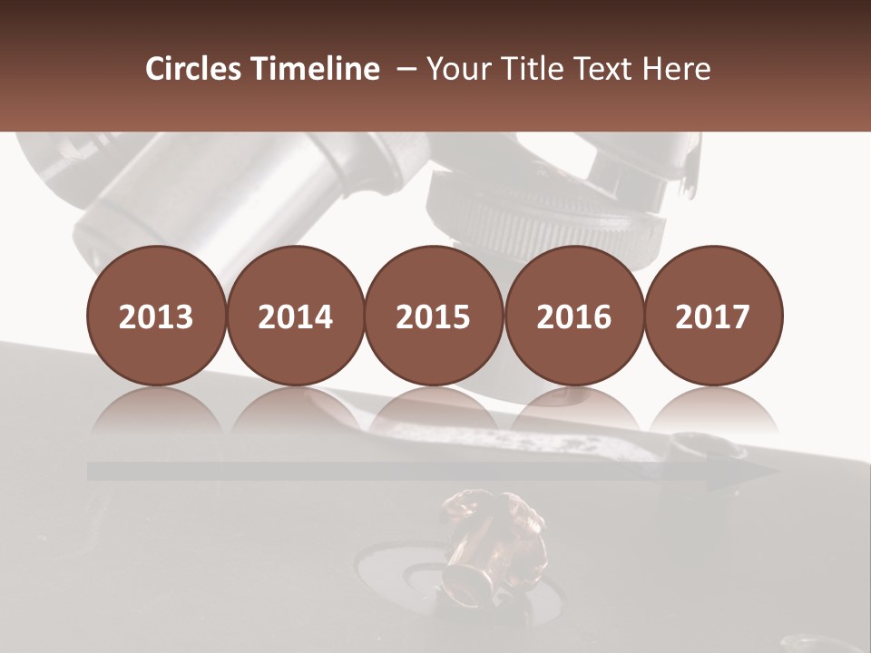 A Microscope And A Piece Of Chocolate On A Table PowerPoint Template