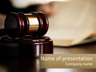 A Judge's Gavel Sitting On Top Of A Wooden Table PowerPoint Template