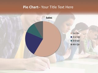 A Group Of People Sitting At A Table Writing PowerPoint Template
