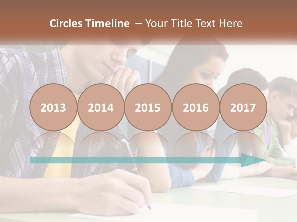 A Group Of People Sitting At A Table Writing PowerPoint Template