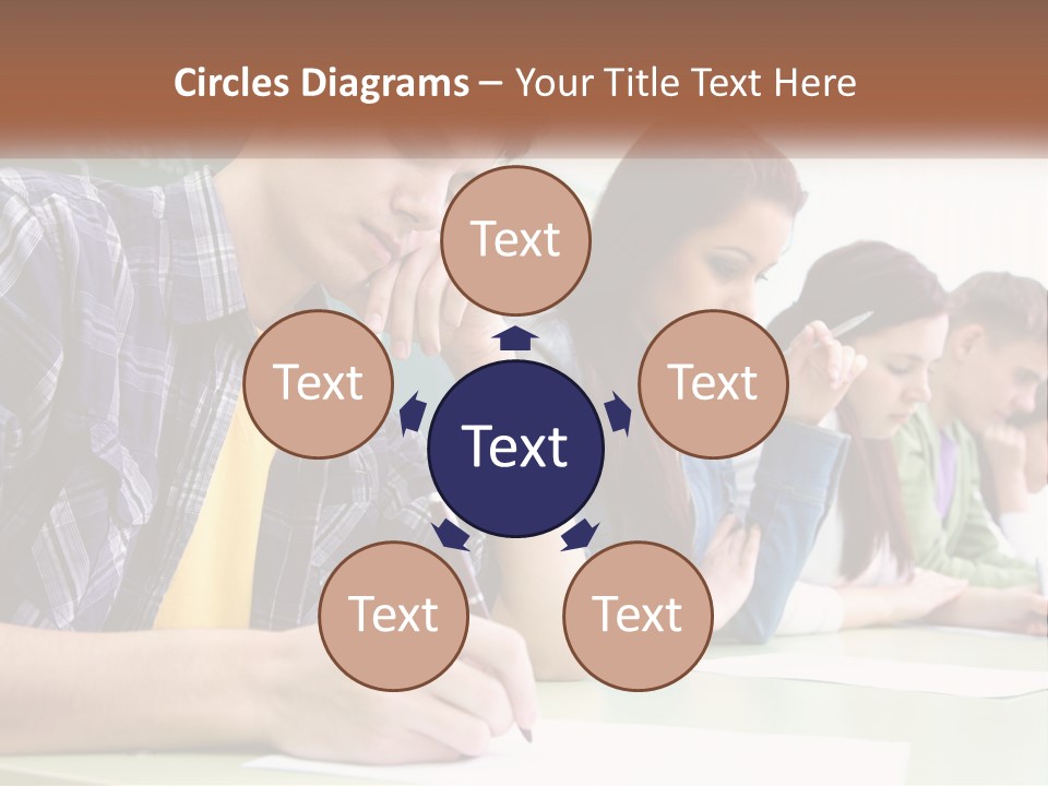 A Group Of People Sitting At A Table Writing PowerPoint Template