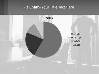 A Man Standing In An Office Looking Out The Window PowerPoint Template