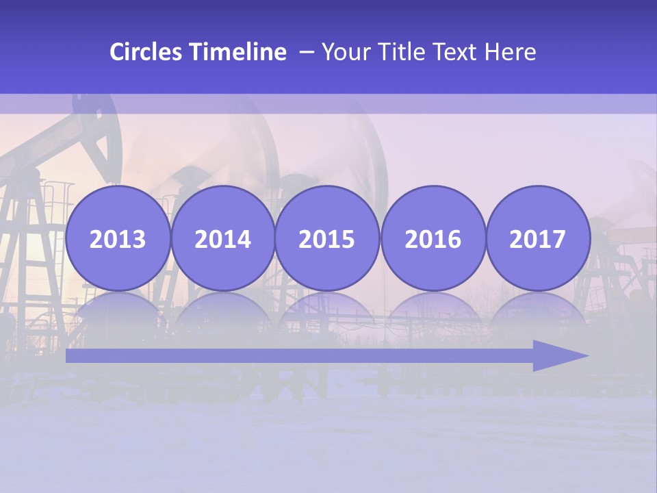 A Group Of Oil Pumps In The Snow PowerPoint Template