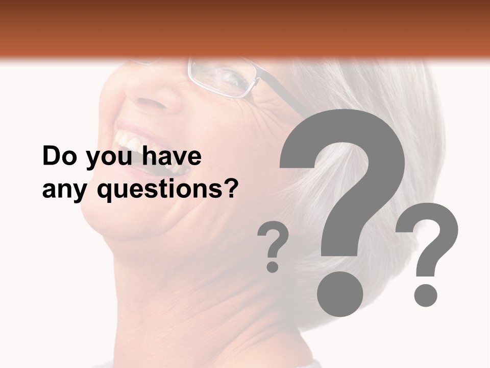 An Older Woman With Glasses Smiling For The Camera PowerPoint Template