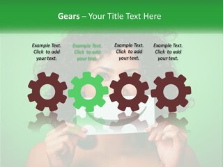 A Woman Holding A Card With A Smiley Face On It PowerPoint Template