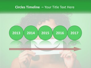 A Woman Holding A Card With A Smiley Face On It PowerPoint Template